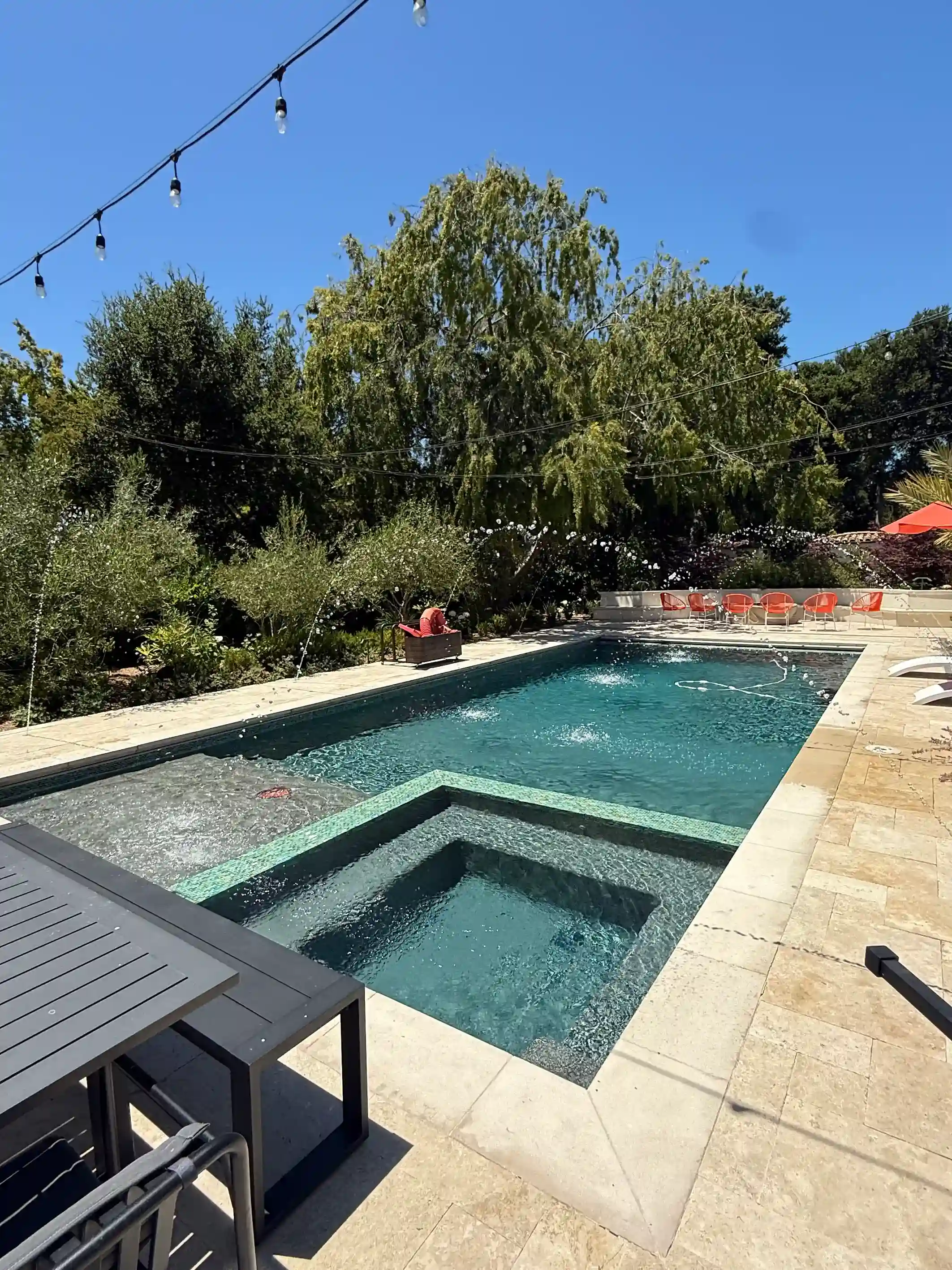 Luxury pool and spa combo with premium finishes by Legendary Pools Inc.