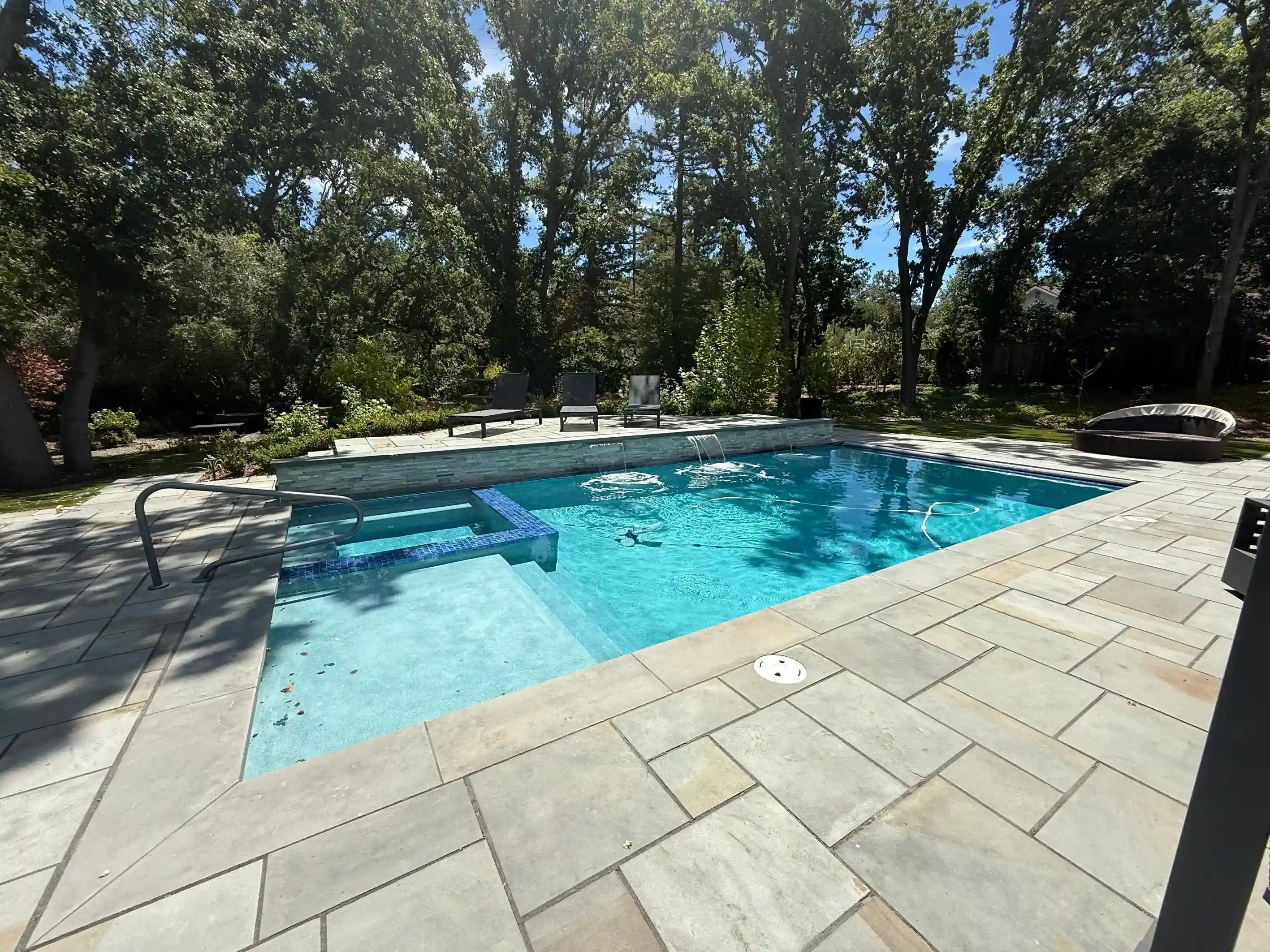 Exquisite pool project showcasing precision tile work and luxury features by Legendary Pools Inc.